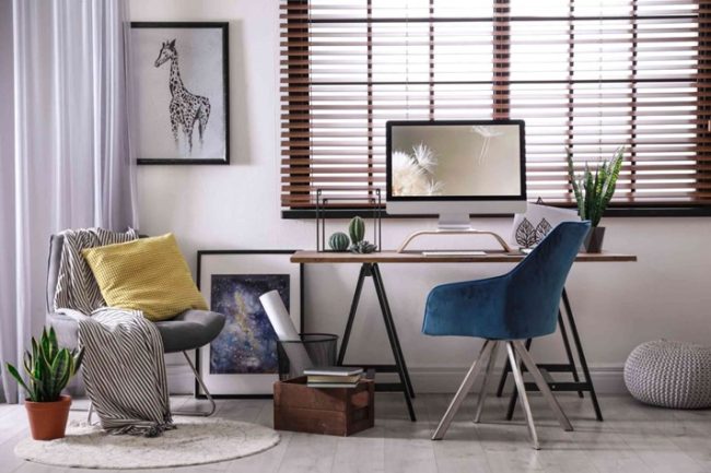 Modern home office featuring Venetian blinds.